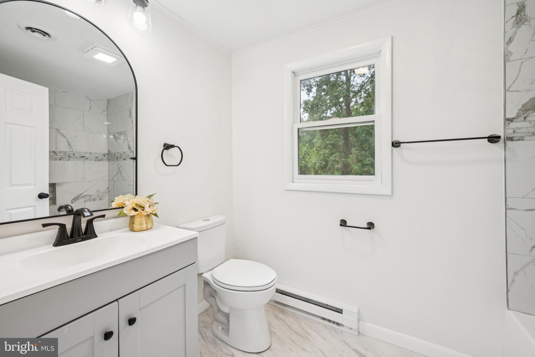 651 Erial Road Sicklerville, NJ 08081 - Photo 17 of 24 a bathroom with a toilet sink and mirror