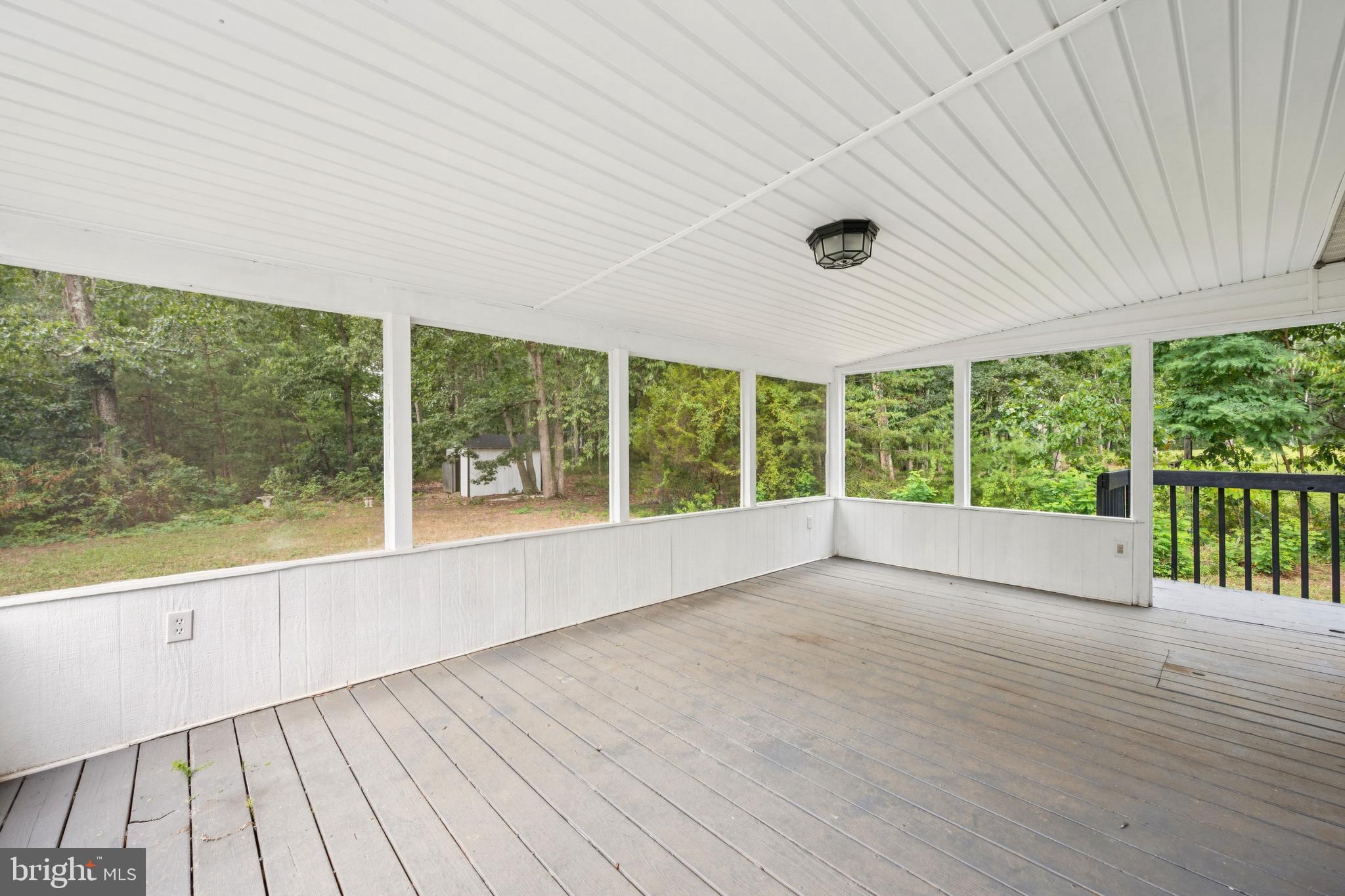 651 Erial Road Sicklerville, NJ 08081 - Photo 19 of 24 a view of an empty room with wooden floor and a large window
