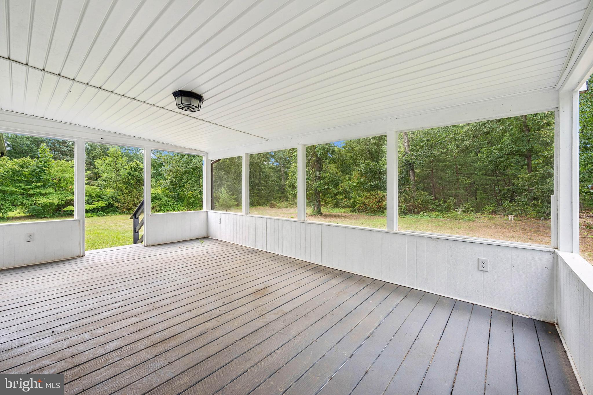 651 Erial Road Sicklerville, NJ 08081 - Photo 20 of 24 a view of an empty room with wooden floor and windows