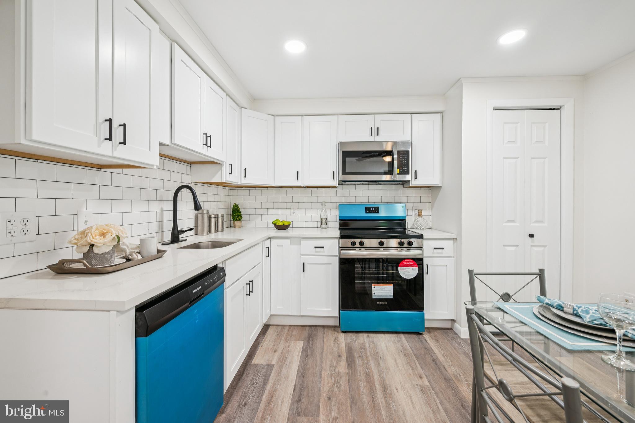 651 Erial Road Sicklerville, NJ 08081 - Photo 10 of 24 a kitchen with a sink stove top oven and cabinets