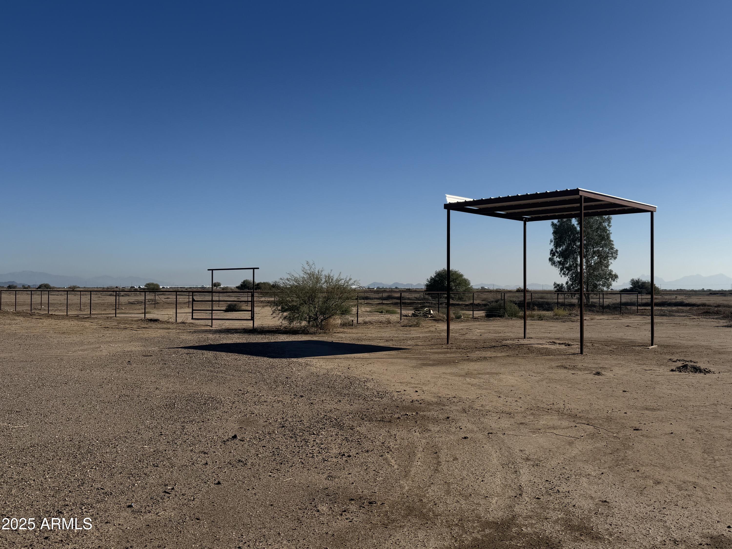 21503 South Toltec Road, Unit 9 Eloy, AZ 85131 - Photo 3 of 4 a view of swimming pool with a yard