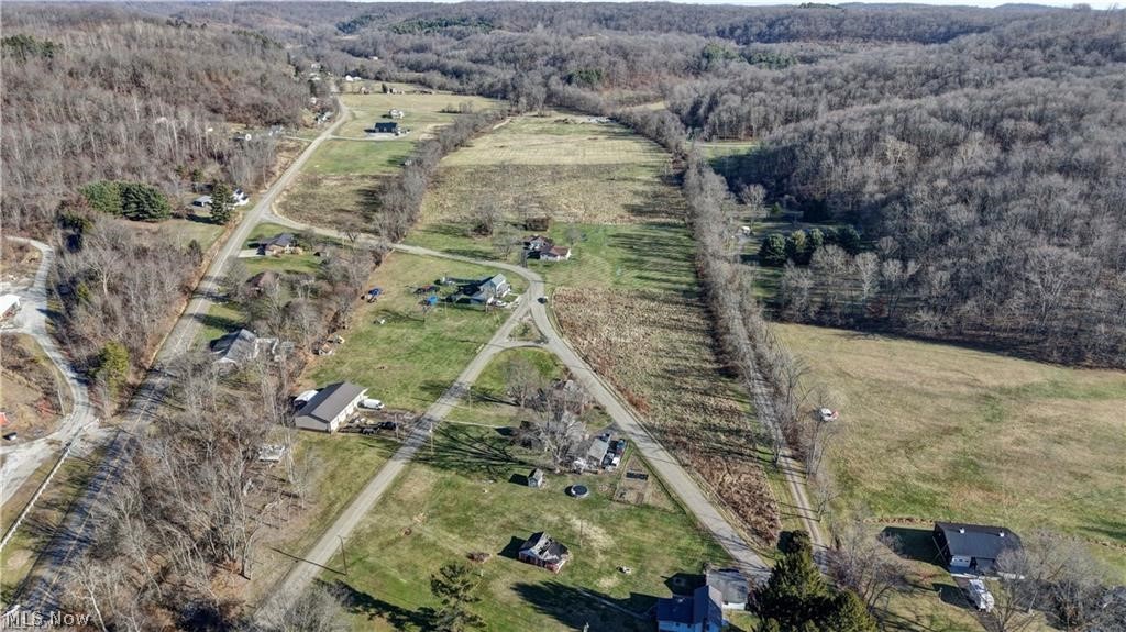 Canary Road Southeast Dennison, OH 44621 - Photo 2 of 4 Aerial overview of property's location featuring a heavily wooded area and rural landscape