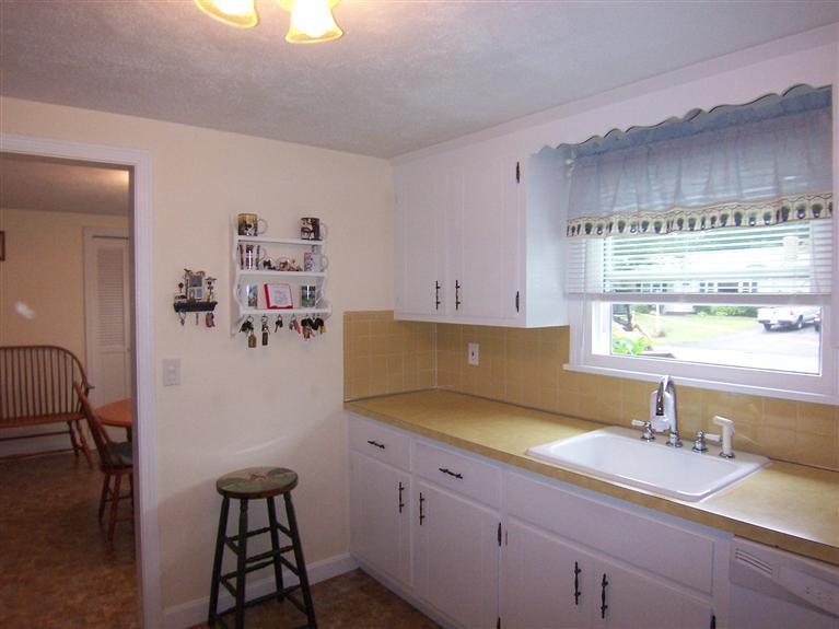 96 Sheaffer Road Centerville, MA 02632 - Photo 20 of 33 a kitchen with a sink cabinets and window