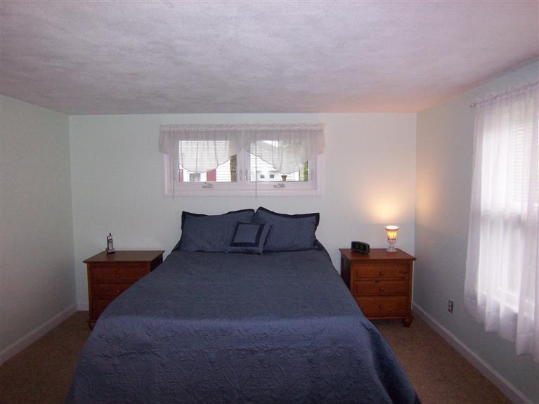 96 Sheaffer Road Centerville, MA 02632 - Photo 22 of 33 a bed room with furniture and a window