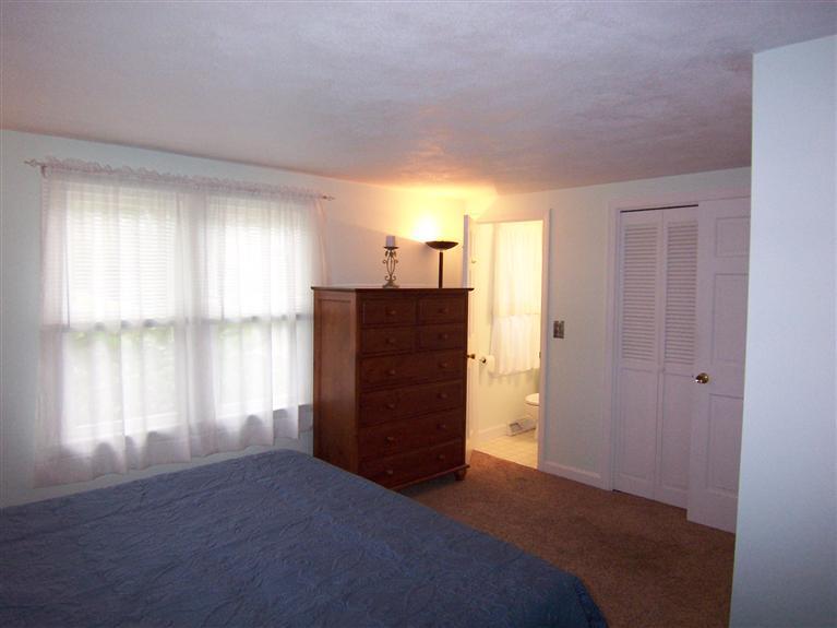 96 Sheaffer Road Centerville, MA 02632 - Photo 23 of 33 a view of empty room with wooden floor and fan