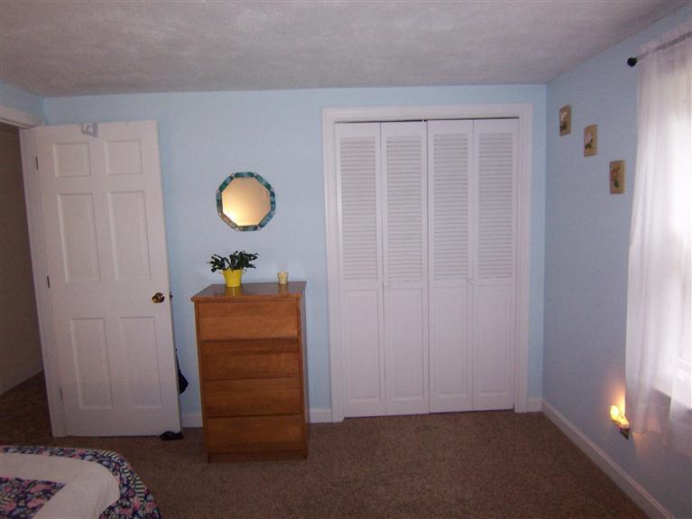 96 Sheaffer Road Centerville, MA 02632 - Photo 26 of 33 a view of a room with wooden floor and cabinet