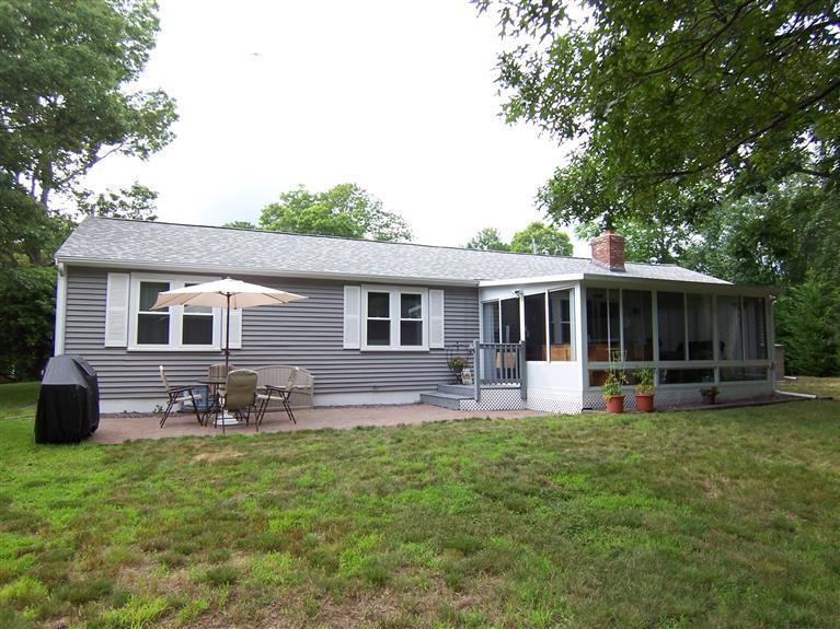 96 Sheaffer Road Centerville, MA 02632 - Photo 3 of 33 a front view of house with yard and outdoor seating