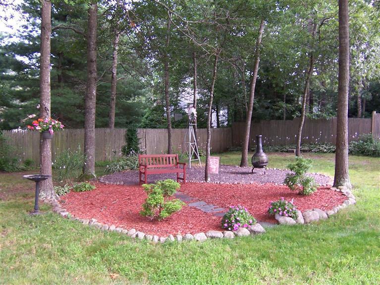 96 Sheaffer Road Centerville, MA 02632 - Photo 9 of 33 a view of a chair and tables in the garden