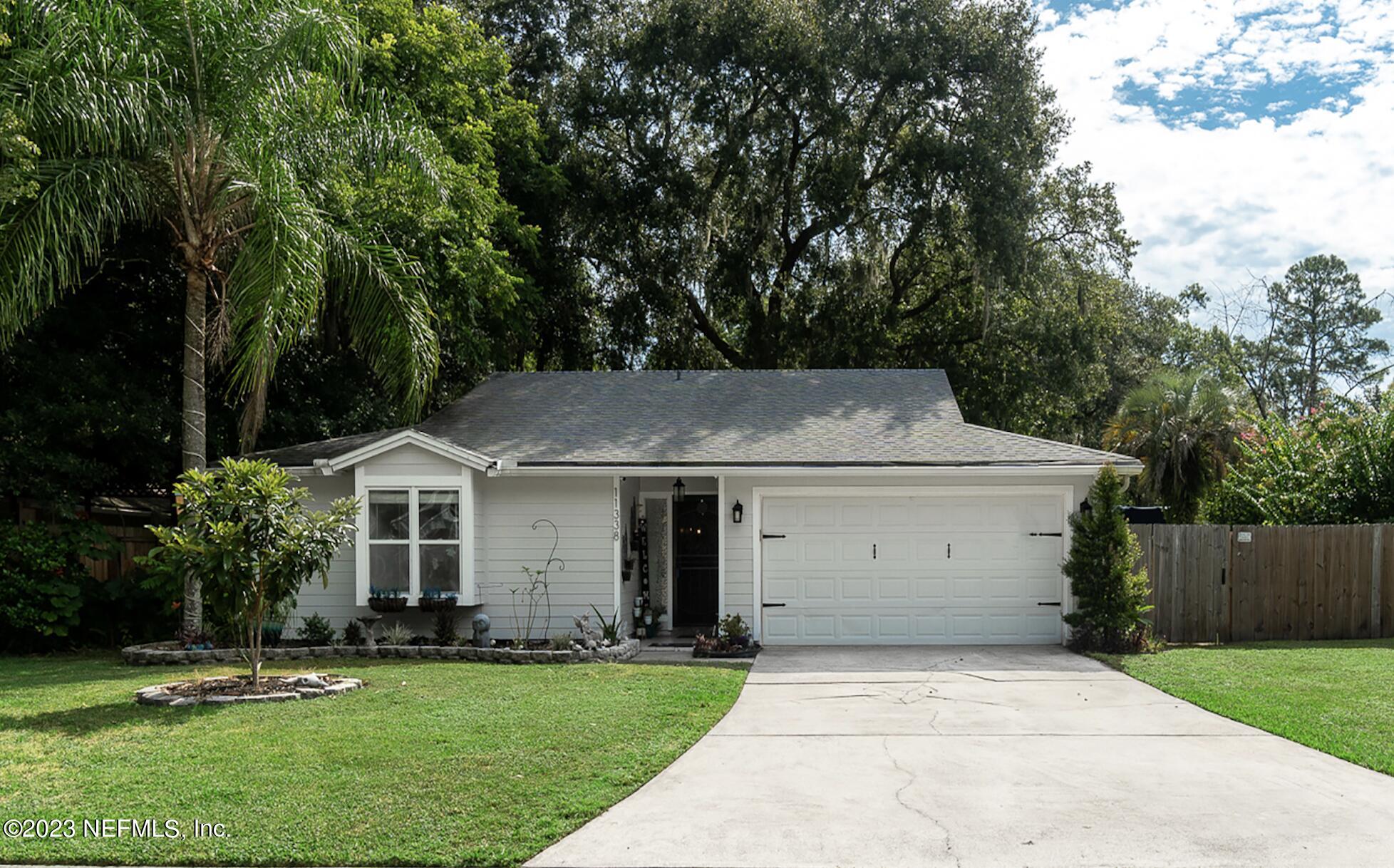 front view of a house with a yard