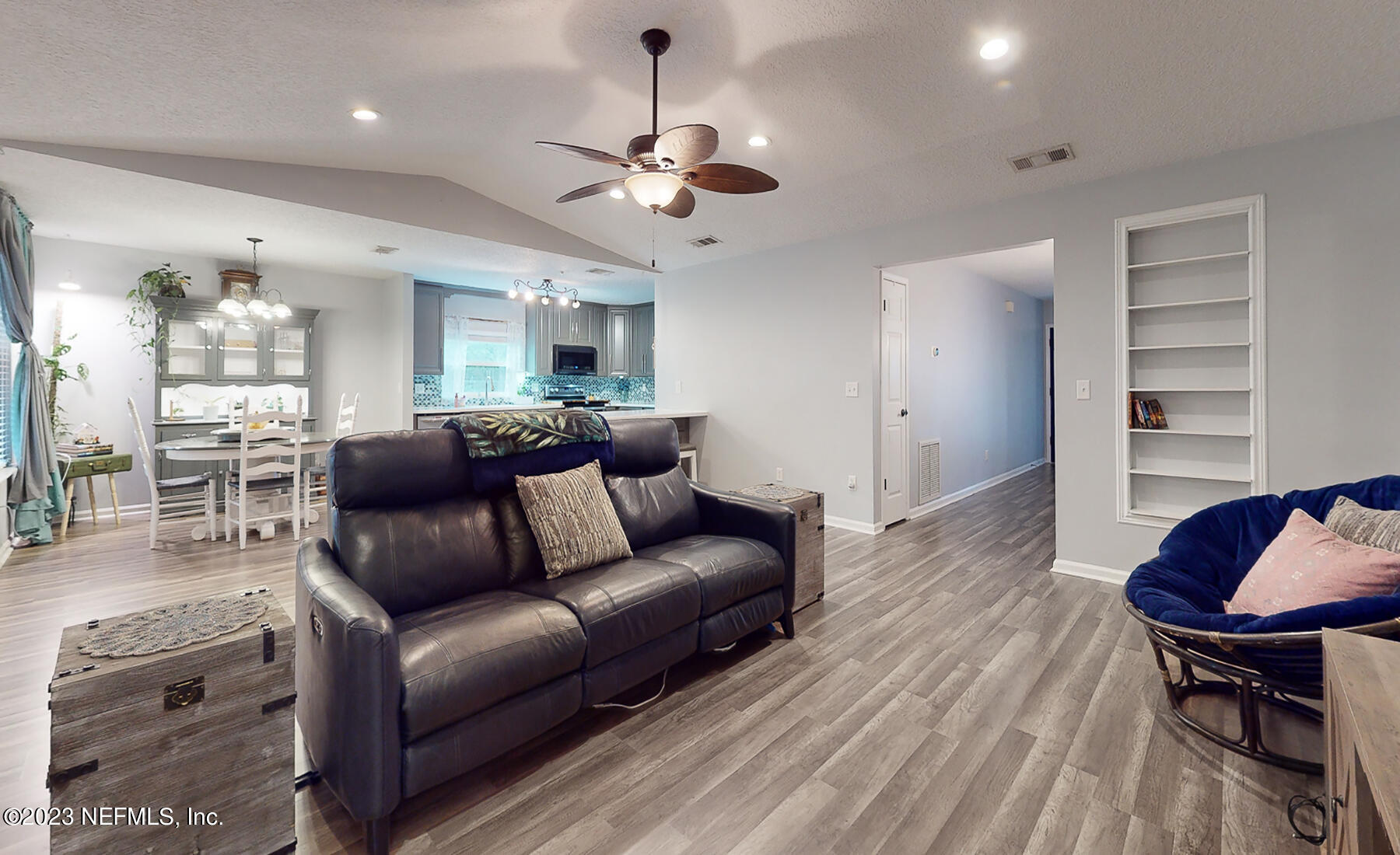 11338 Rustic Pines Circle East Jacksonville, FL 32257 - Photo 11 of 33 a view of living room kitchen and a wooden floor