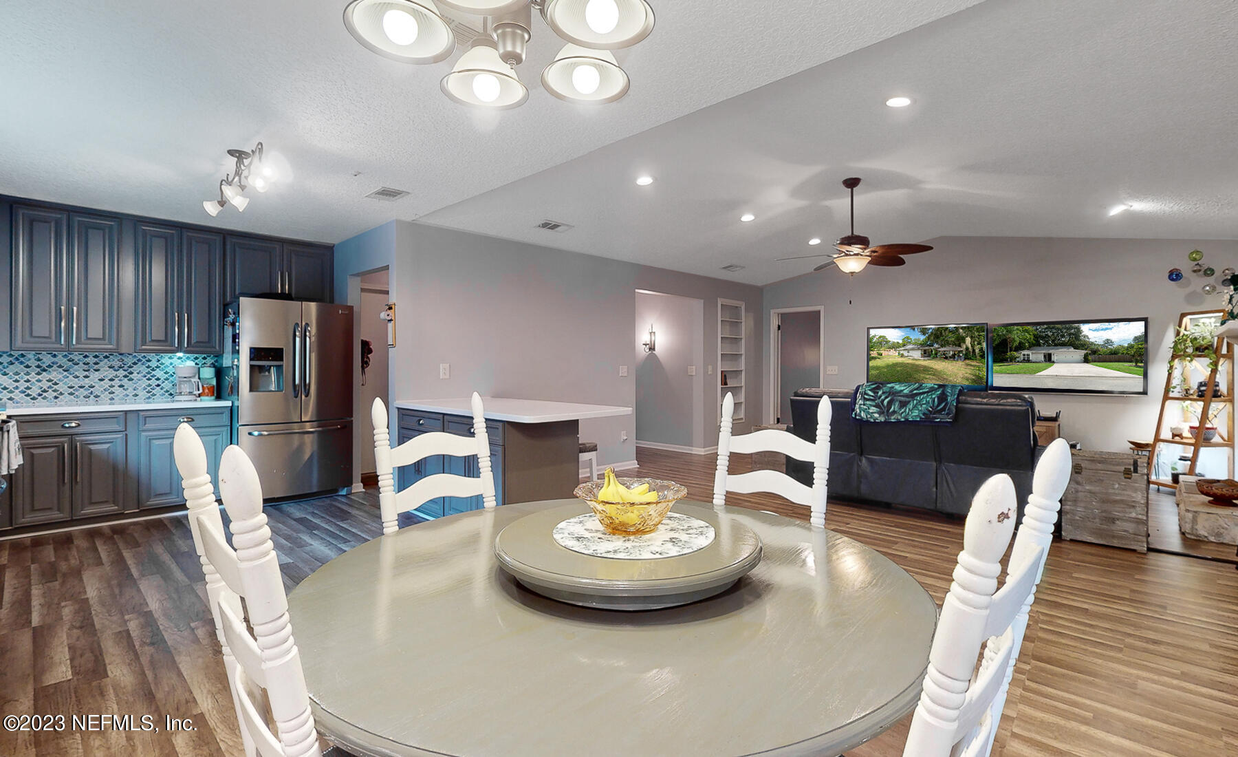 11338 Rustic Pines Circle East Jacksonville, FL 32257 - Photo 13 of 33 a large kitchen with a table and chairs