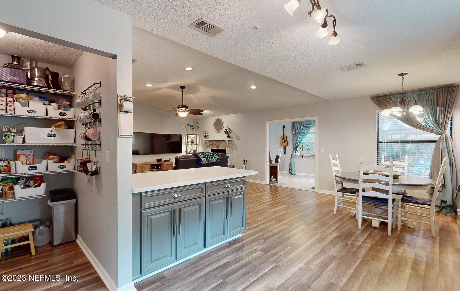 11338 Rustic Pines Circle East Jacksonville, FL 32257 - Photo 15 of 33 a living room with stainless steel appliances furniture a rug and a kitchen view