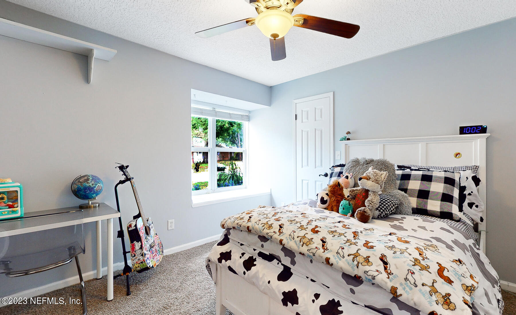 11338 Rustic Pines Circle East Jacksonville, FL 32257 - Photo 17 of 33 a bedroom with bed and a window