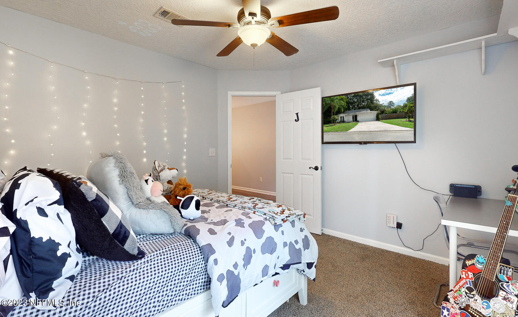 11338 Rustic Pines Circle East Jacksonville, FL 32257 - Photo 18 of 33 a bedroom with a bed and a window
