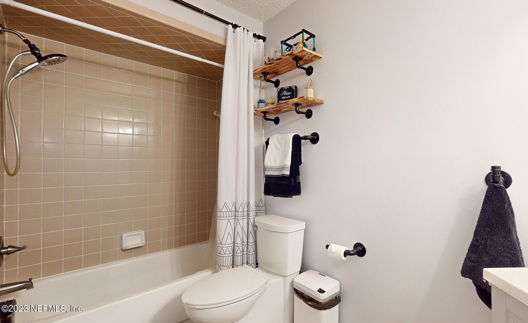 11338 Rustic Pines Circle East Jacksonville, FL 32257 - Photo 20 of 33 a bathroom with a toilet and a shower