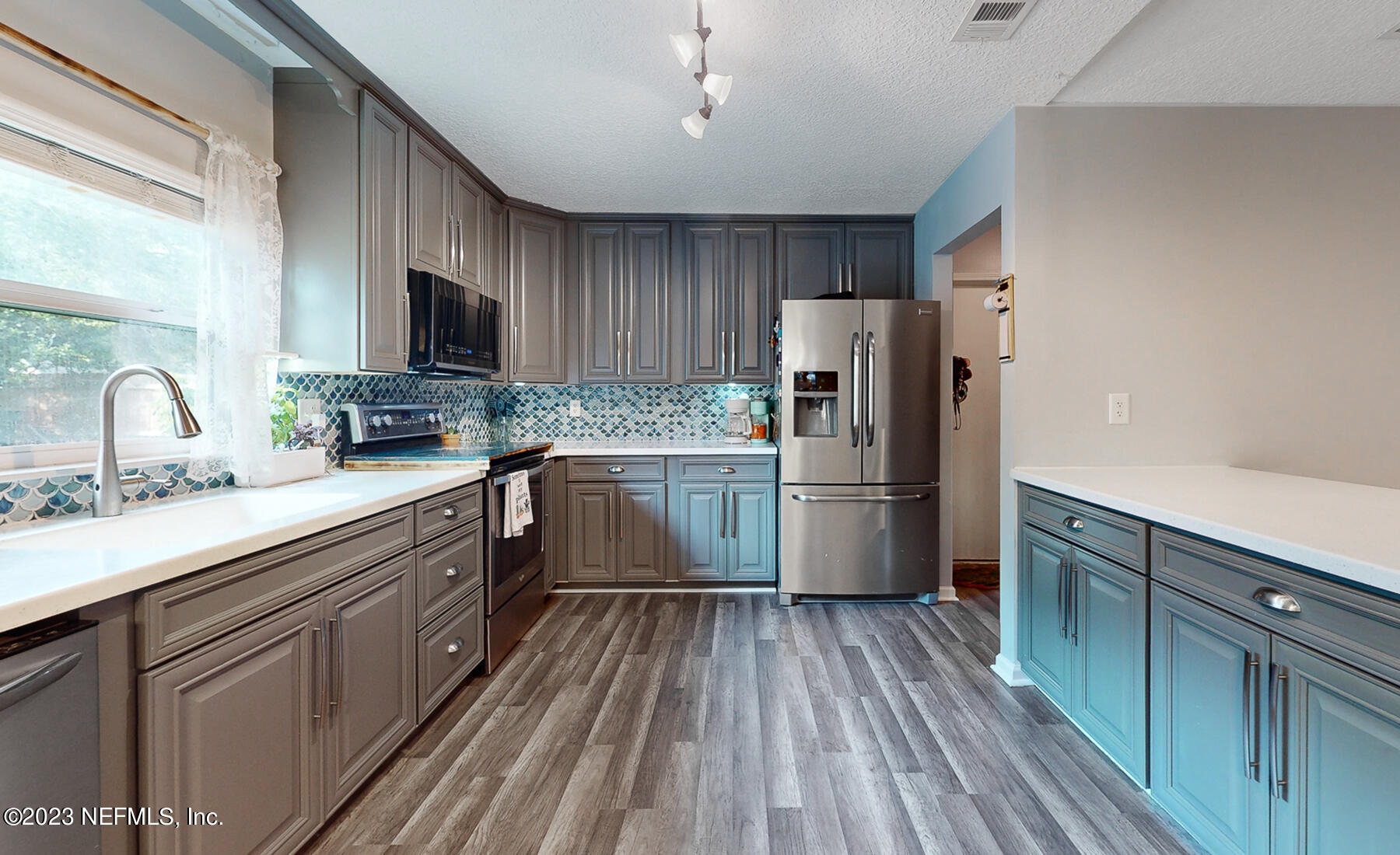 11338 Rustic Pines Circle East Jacksonville, FL 32257 - Photo 2 of 33 a kitchen with a refrigerator a sink dishwasher stove and oven
