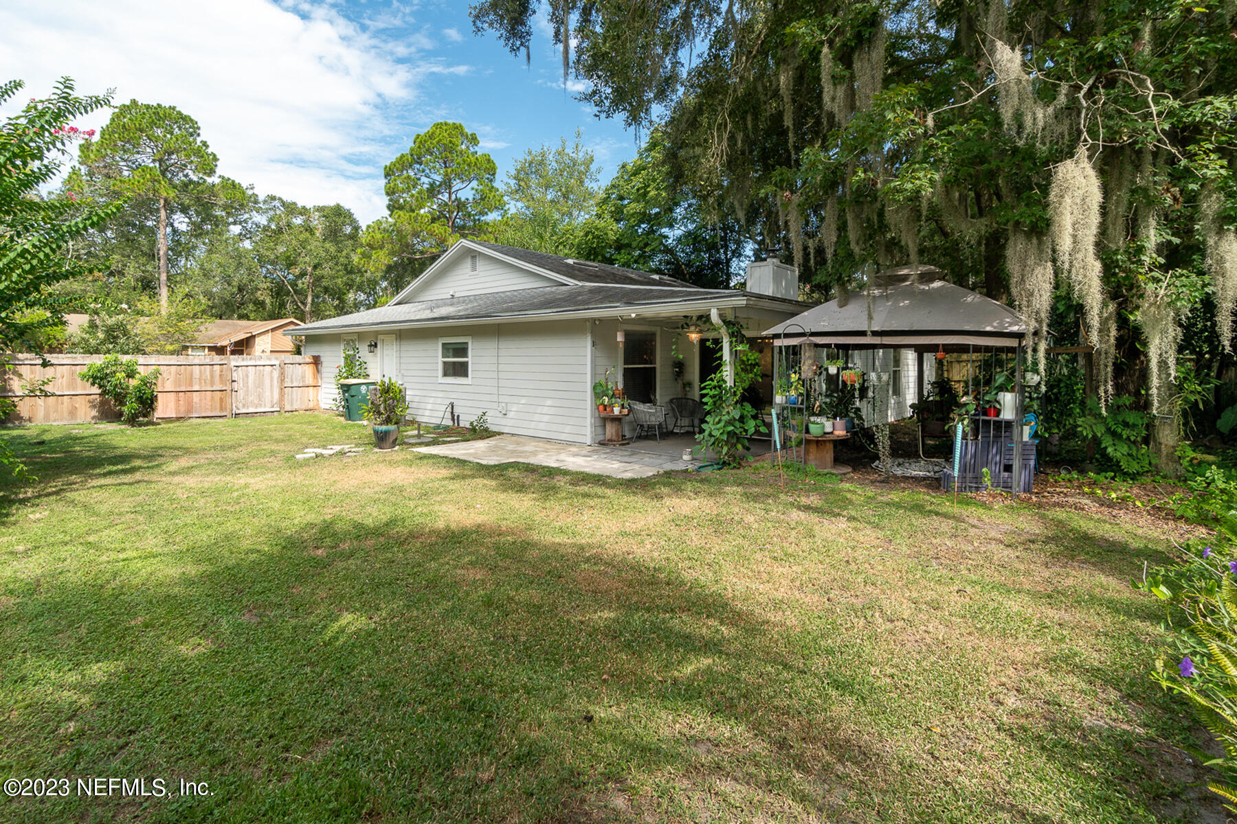 11338 Rustic Pines Circle East Jacksonville, FL 32257 - Photo 30 of 33 a view of a house with a backyard