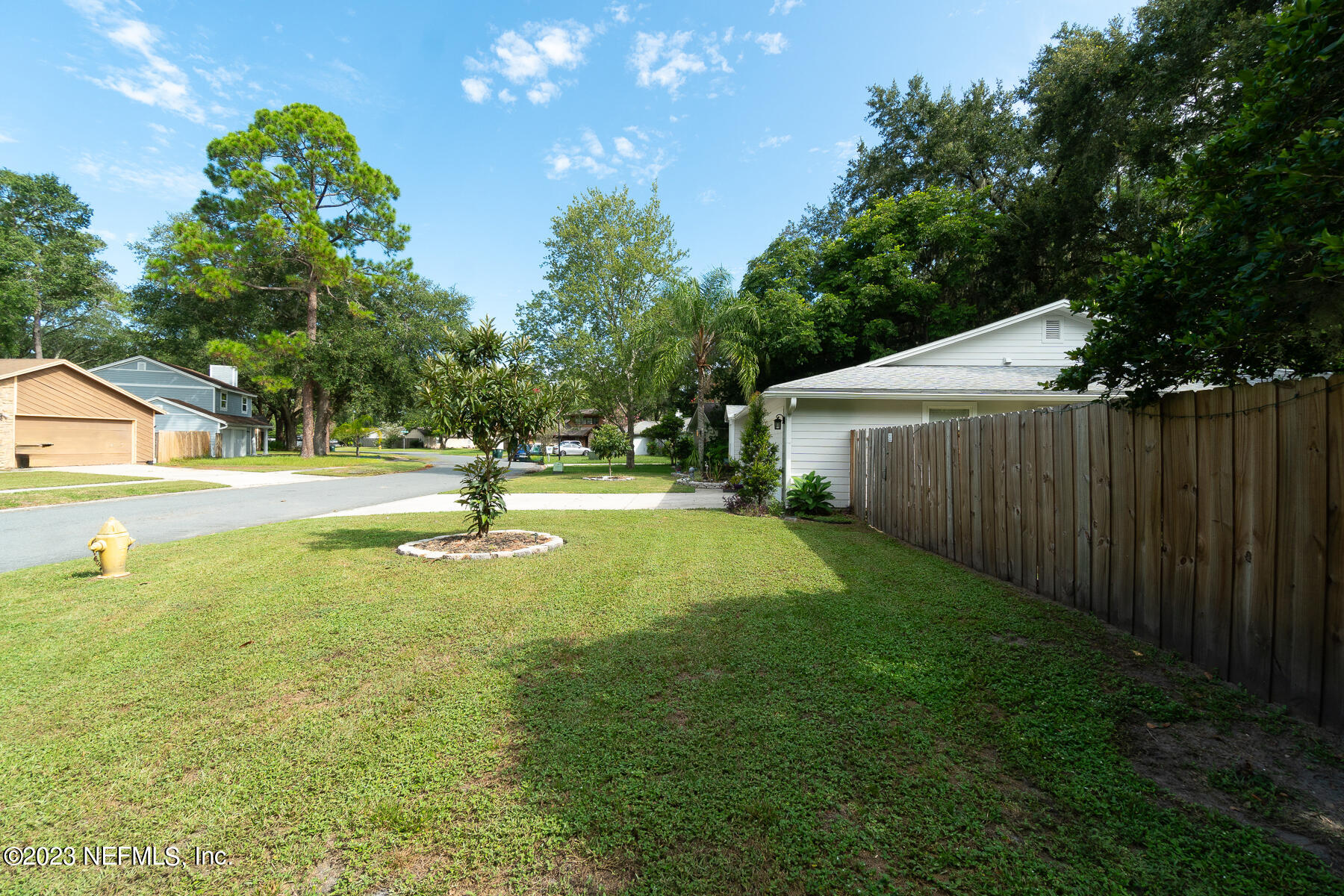 11338 Rustic Pines Circle East Jacksonville, FL 32257 - Photo 6 of 33 a view of a house with basketball court
