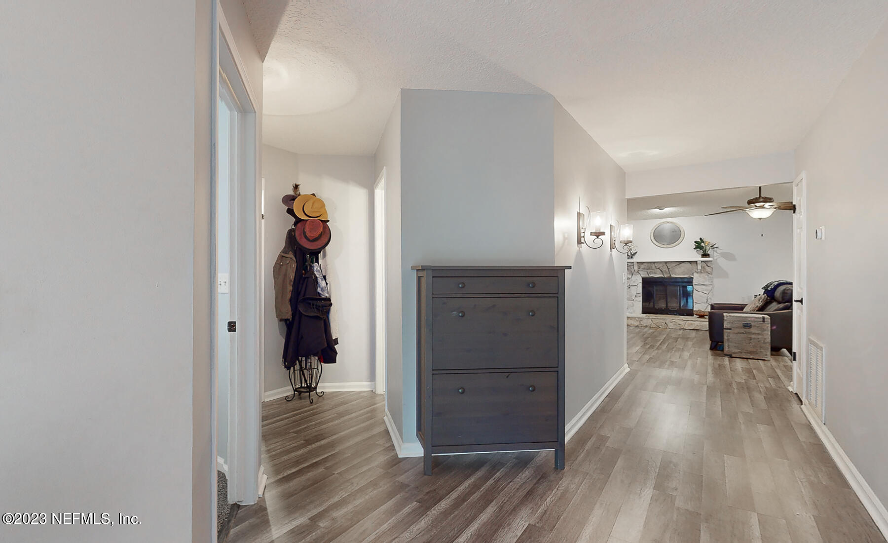 11338 Rustic Pines Circle East Jacksonville, FL 32257 - Photo 9 of 33 a view of a hallway view with wooden floor and furniture