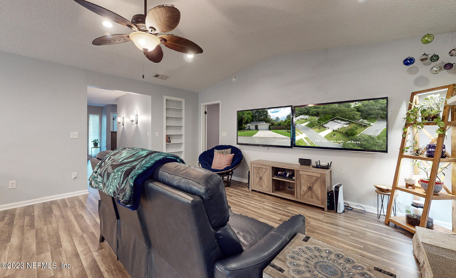 11338 Rustic Pines Circle East Jacksonville, FL 32257 - Photo 10 of 33 a living room with furniture and a flat screen tv