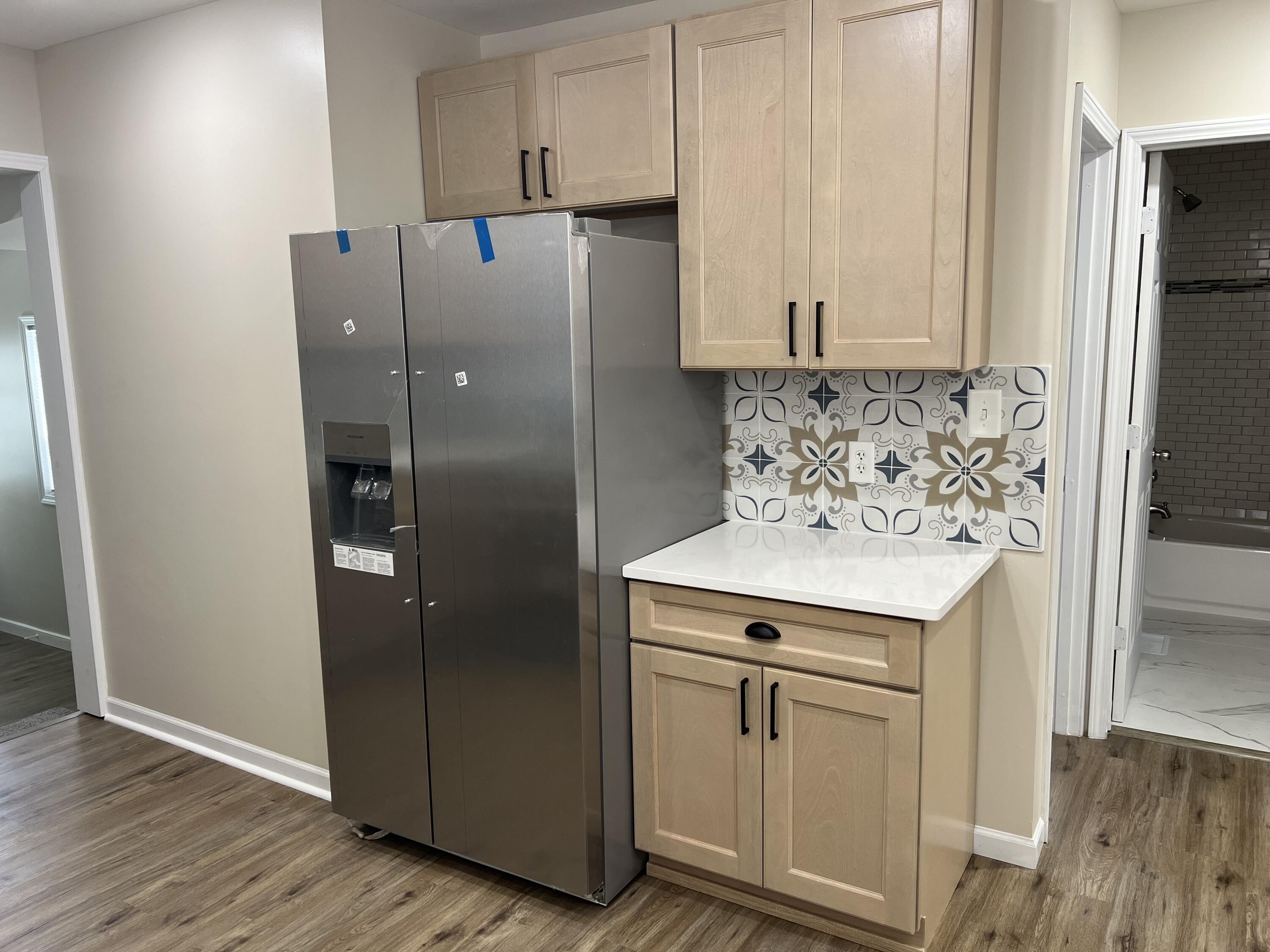 3851 Maple Street Hobart, IN 46342 - Photo 14 of 28 a kitchen with stainless steel appliances granite countertop a refrigerator and a stove
