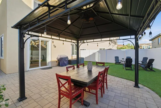 a patio with a table and chairs