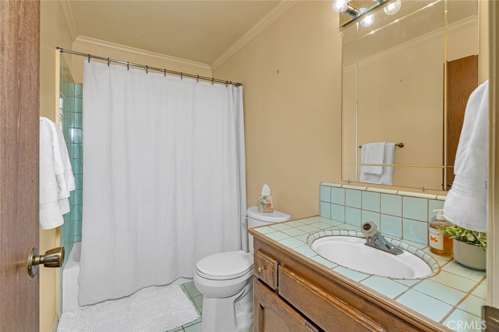 5030 Creek Front Road Catheys Valley, CA 95306 - Photo 27 of 69 a bathroom with a granite countertop sink and a mirror