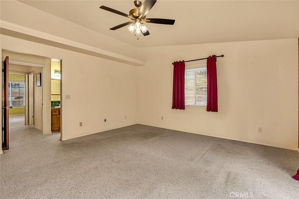 5030 Creek Front Road Catheys Valley, CA 95306 - Photo 28 of 69 an empty room with windows and fan