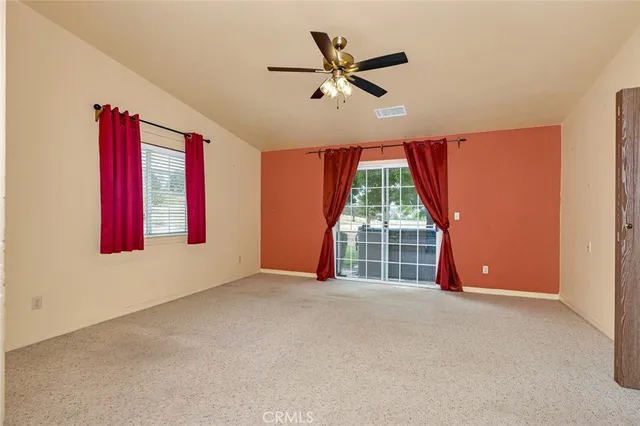a view of a house with a large tree in front of a house