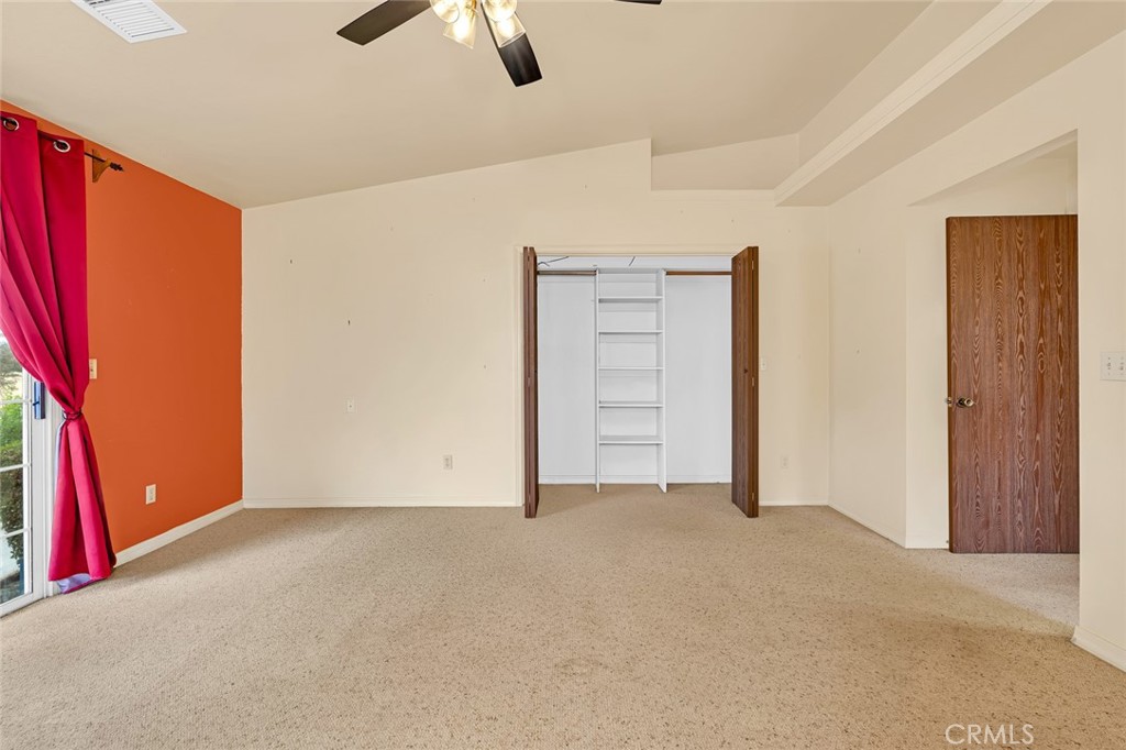 5030 Creek Front Road Catheys Valley, CA 95306 - Photo 32 of 69 an empty room with closet and windows