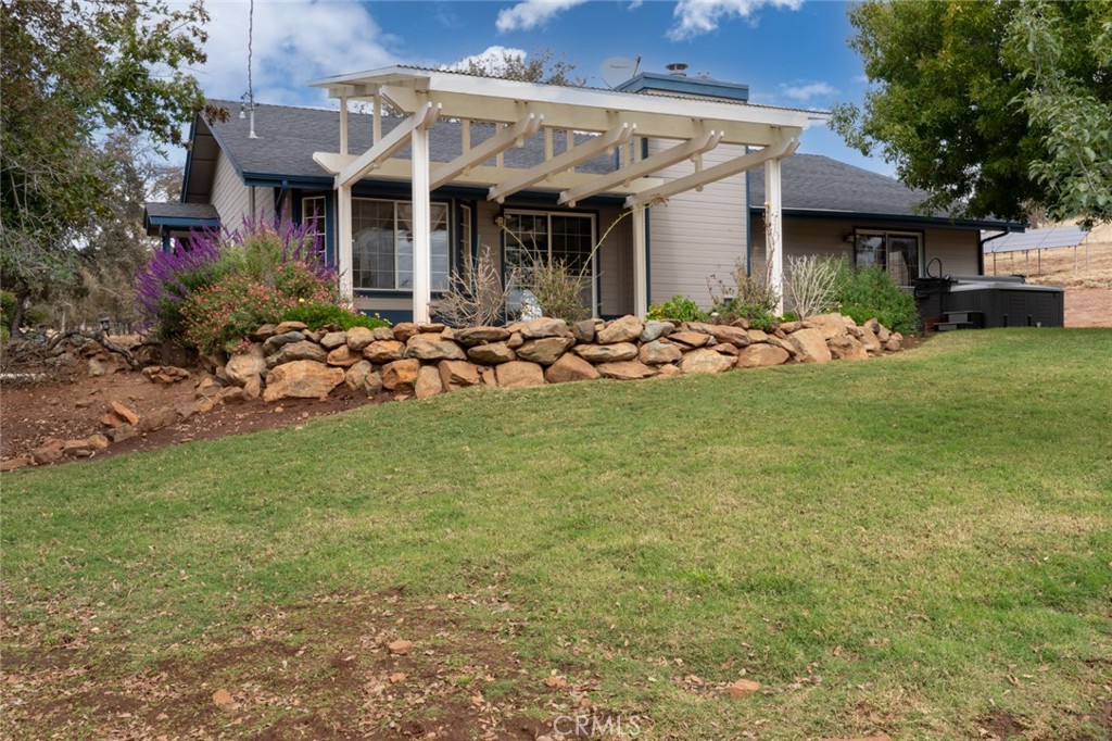 5030 Creek Front Road Catheys Valley, CA 95306 - Photo 35 of 69 a view of a house with garden and porch