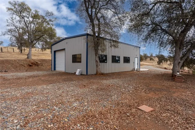a view of a livingroom with a ceiling fan and window