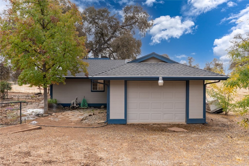 5030 Creek Front Road Catheys Valley, CA 95306 - Photo 45 of 69 a front view of a house with a yard