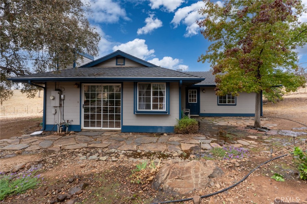 5030 Creek Front Road Catheys Valley, CA 95306 - Photo 46 of 69 a front view of a house with a garden