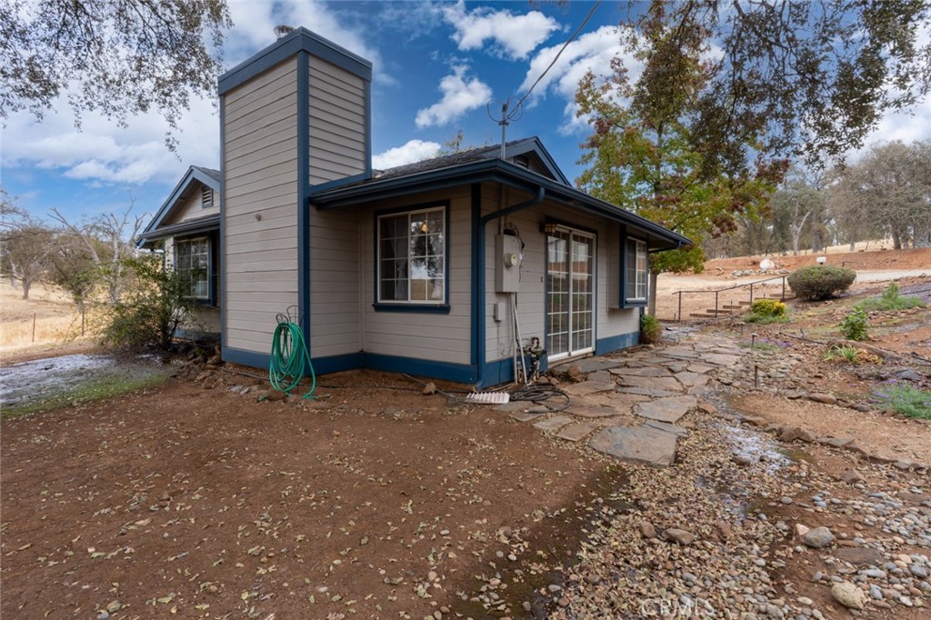 5030 Creek Front Road Catheys Valley, CA 95306 - Photo 47 of 69 a front view of a house with a yard