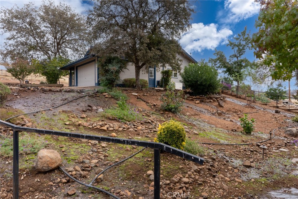 5030 Creek Front Road Catheys Valley, CA 95306 - Photo 5 of 69 a view of a house with a yard