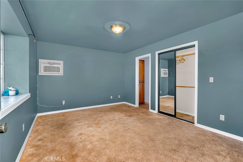 5030 Creek Front Road Catheys Valley, CA 95306 - Photo 58 of 69 an empty room with closet and windows