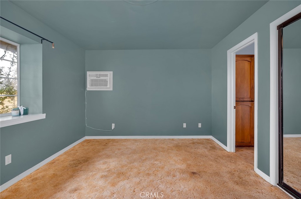 5030 Creek Front Road Catheys Valley, CA 95306 - Photo 59 of 69 an empty room with windows and closet