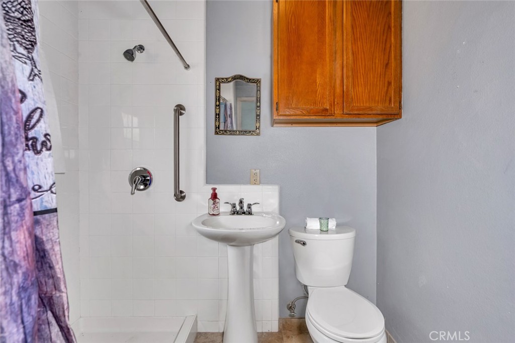 5030 Creek Front Road Catheys Valley, CA 95306 - Photo 60 of 69 a bathroom with a toilet sink and mirror