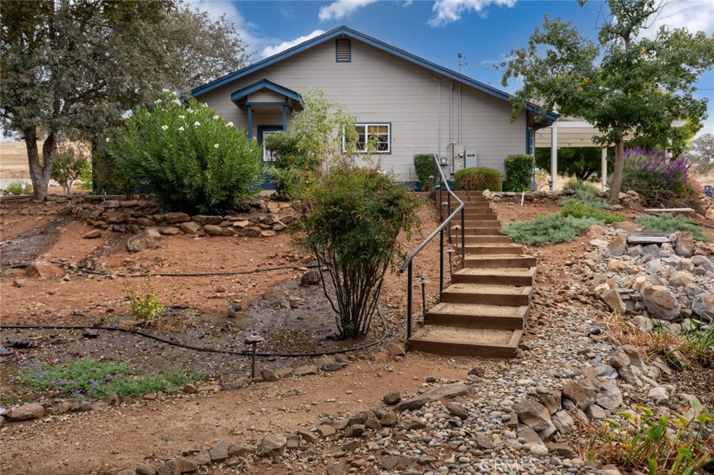 5030 Creek Front Road Catheys Valley, CA 95306 - Photo 6 of 69 a view of a house with backyard and trees