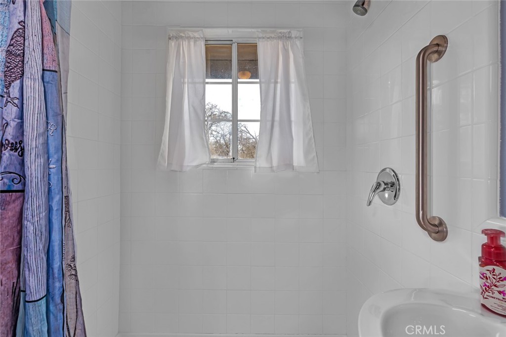 5030 Creek Front Road Catheys Valley, CA 95306 - Photo 61 of 69 a bathroom with a toilet and a shower