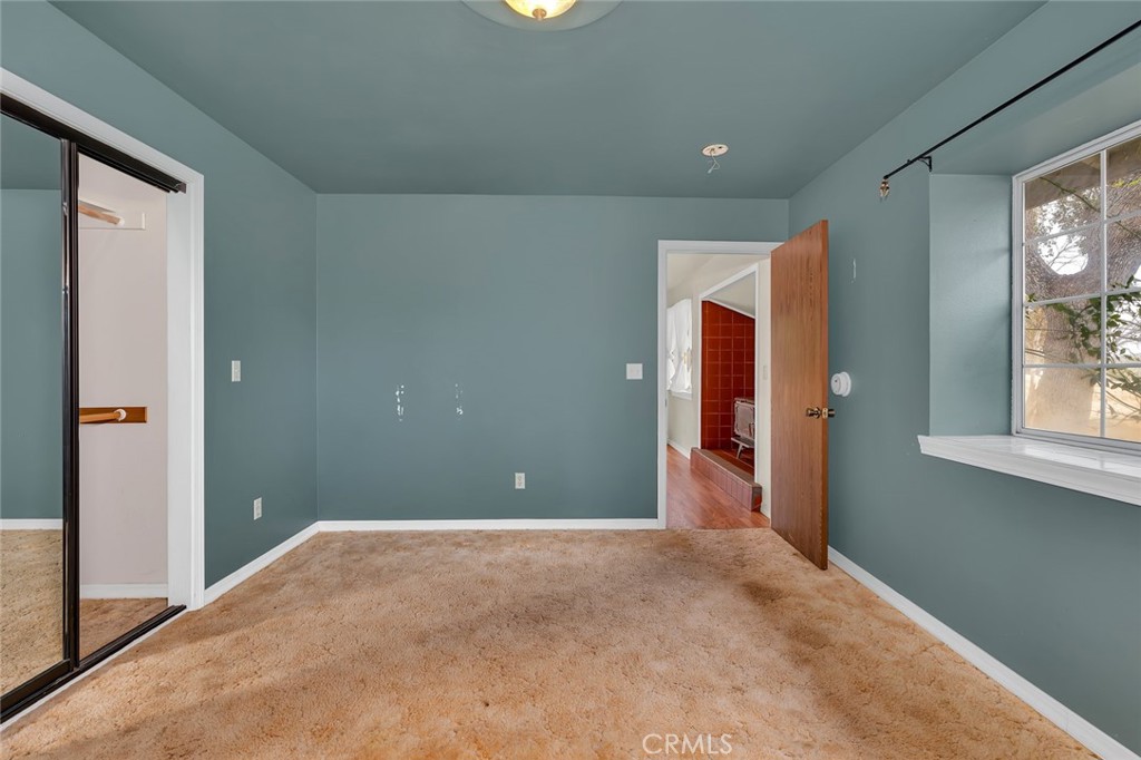 5030 Creek Front Road Catheys Valley, CA 95306 - Photo 62 of 69 a view of a big room with closet and windows