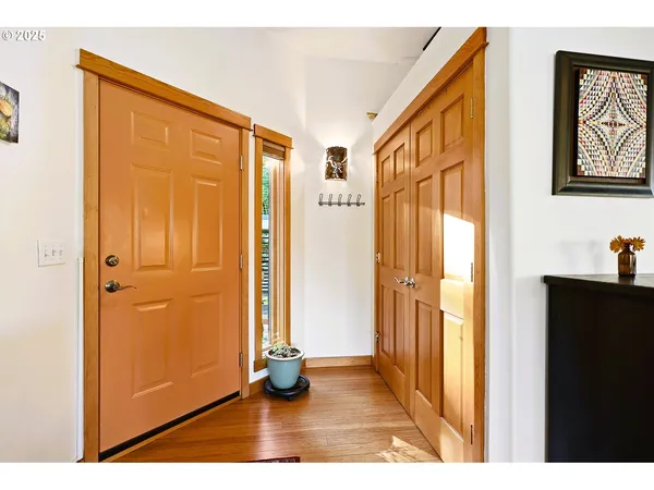 a view of an entryway with wooden floor