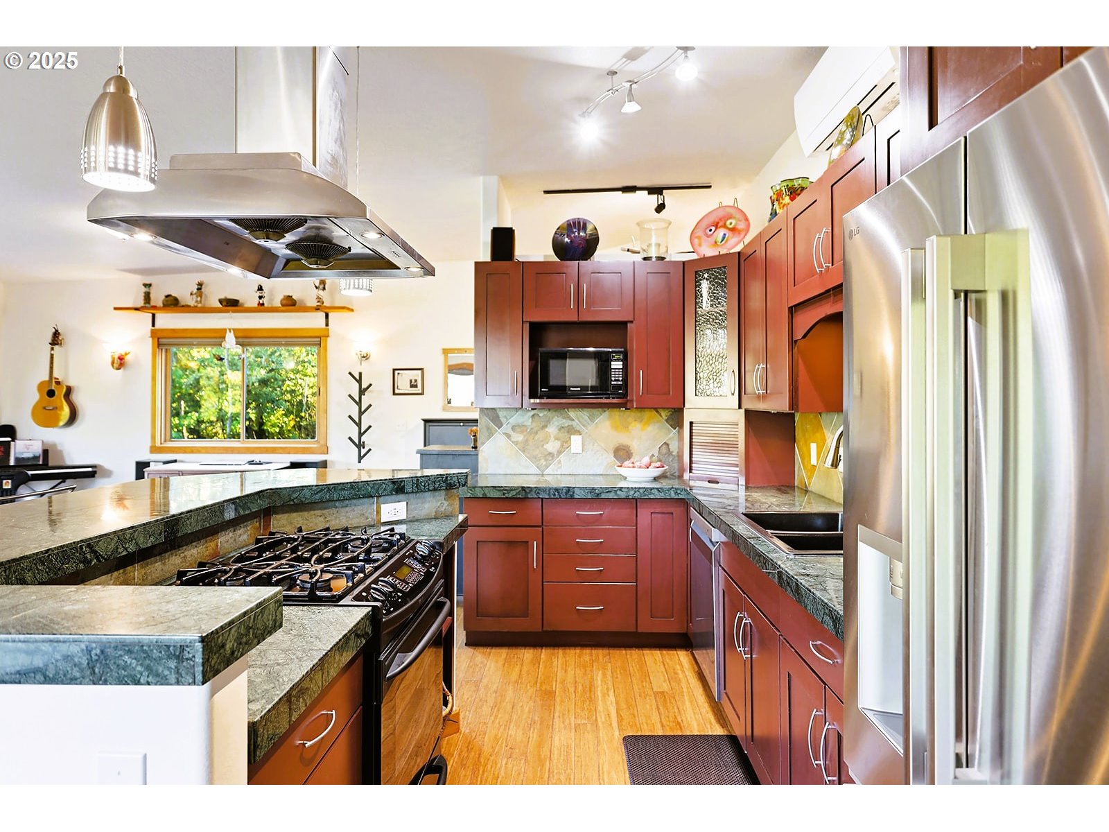 515 East 4th Street, Unit 2 Hood River, OR 97031 - Photo 27 of 48 a kitchen with stainless steel appliances granite countertop a stove and a sink