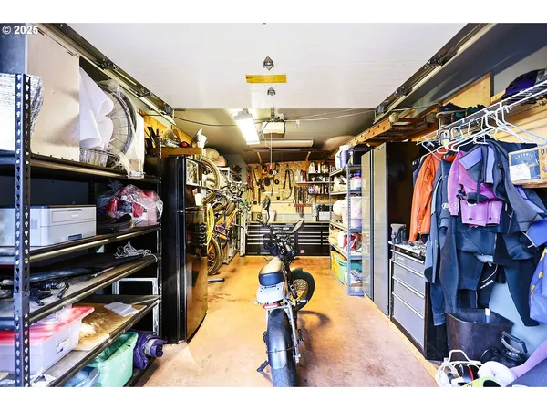a kitchen with stainless steel appliances kitchen island granite countertop a stove and a living room