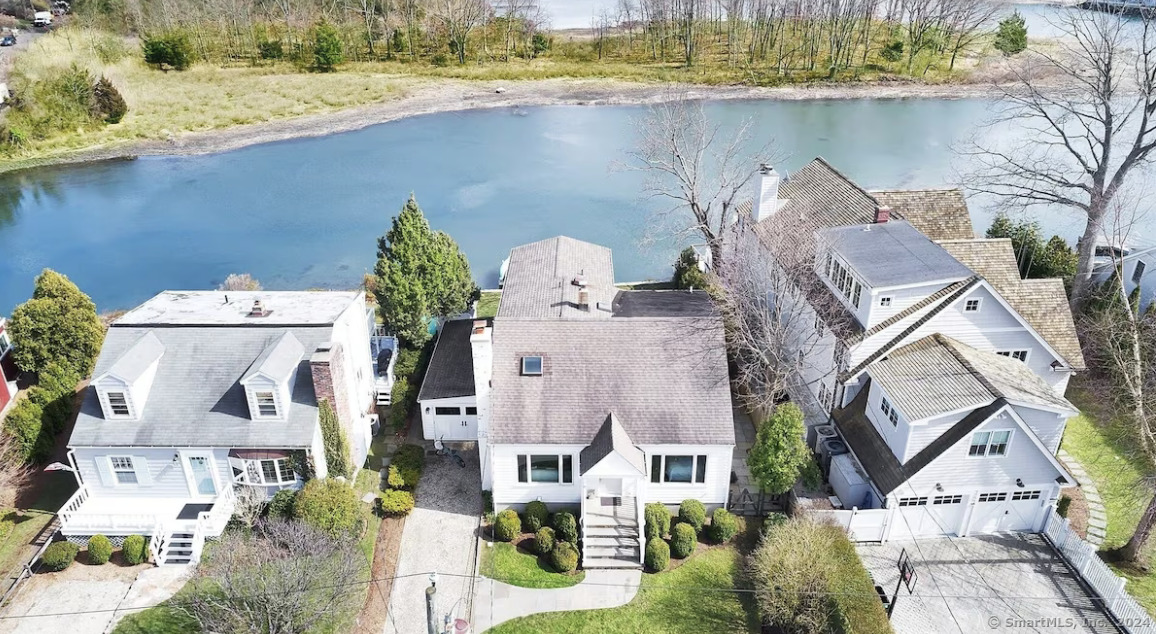 an aerial view of houses with outdoor space