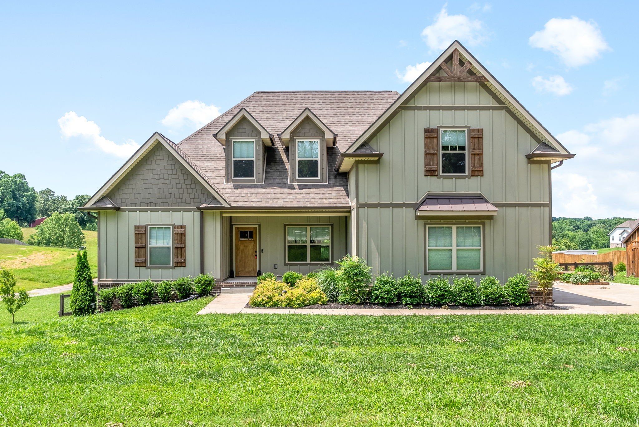 1452 Hickory Point Road Clarksville, TN 37043 - Photo 1 of 38 a front view of a house with garden