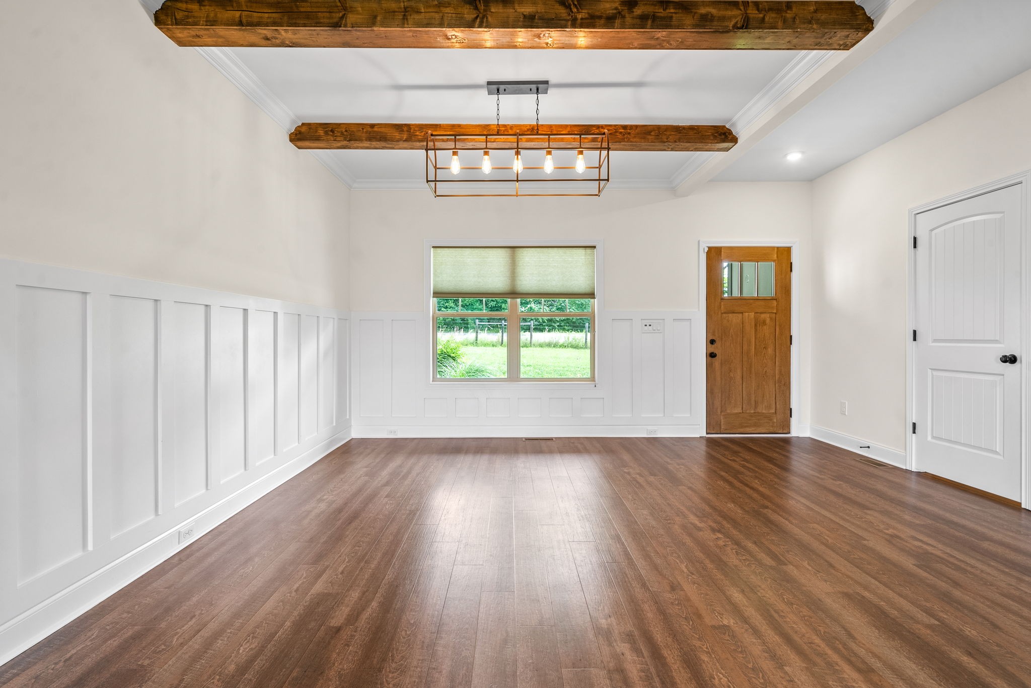 1452 Hickory Point Road Clarksville, TN 37043 - Photo 12 of 38 an empty room with wooden floor and windows