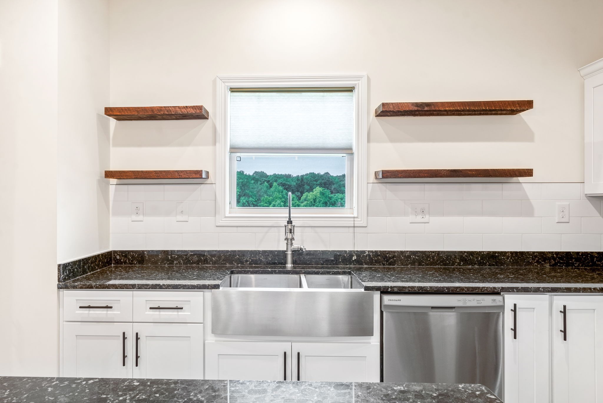1452 Hickory Point Road Clarksville, TN 37043 - Photo 16 of 38 a kitchen with granite countertop a sink and a stove