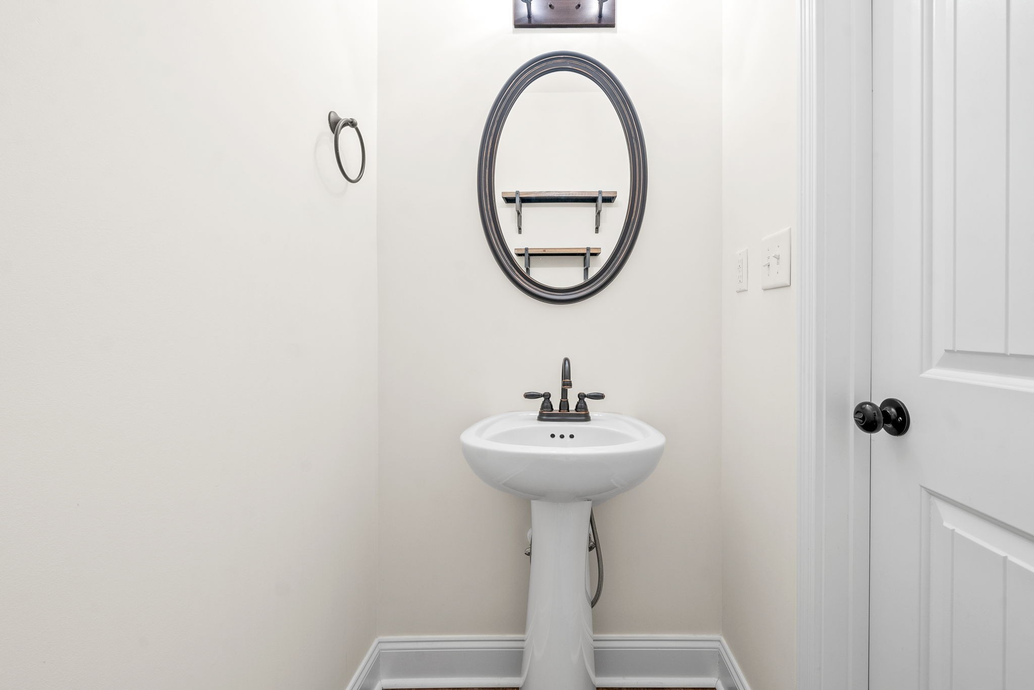 1452 Hickory Point Road Clarksville, TN 37043 - Photo 18 of 38 a bathroom with a sink and a mirror